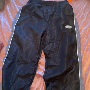 Black track pants w/ spilt on both legs